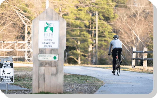 A person riding bicycle in the Stone Mountain park